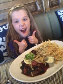 Someone is happy about her steak and frites. Cooked to PERFECTION I might add.